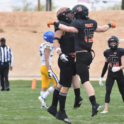 Apple Valley's Ethan Peratt, right, celebrates wit