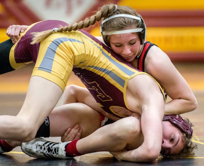 Metamora's Cera Jones, top, battles East Peoria's Stephen Preciado during a dual meet Thursday, April 29, 2021 at East Peoria High School. 