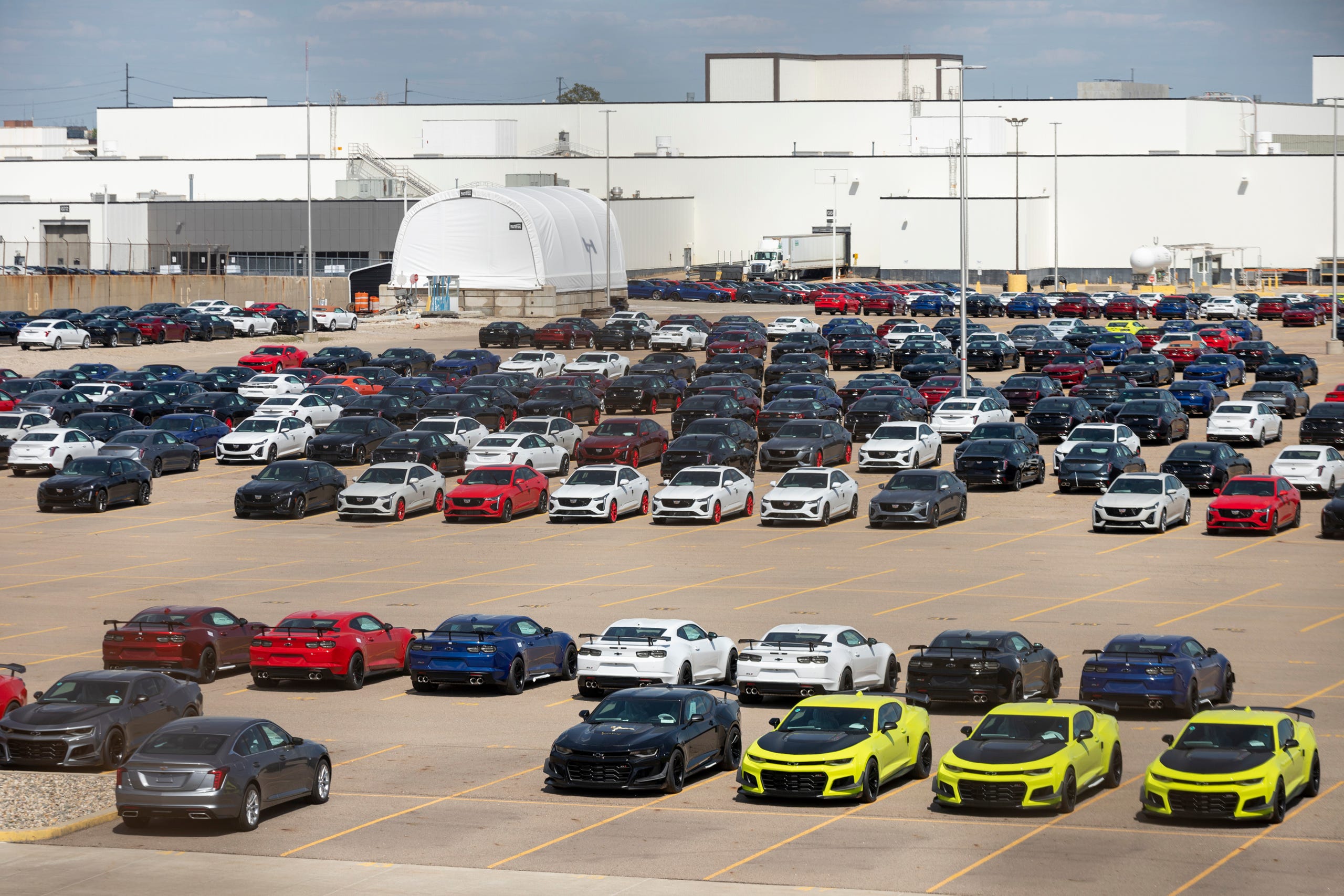 Parked Chevy Camaros and Cadillac CT4s and CT5s in the parking lot of GM Lansing Grand River Assembly on May 14, 2021, in Lansing.