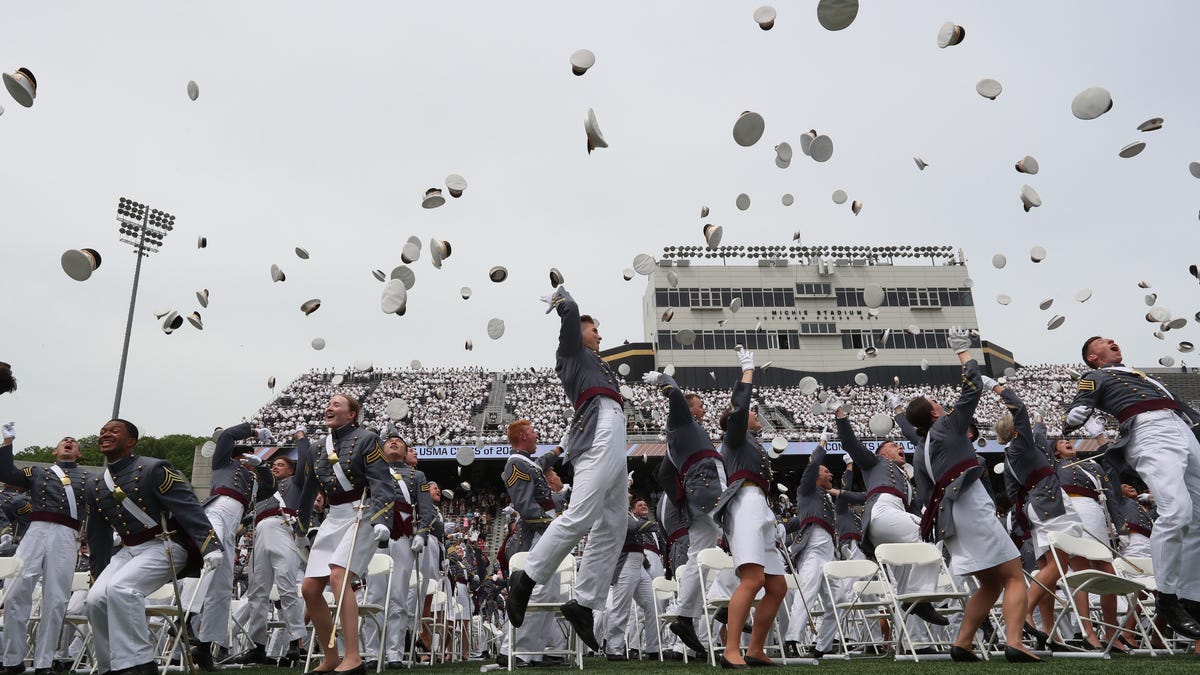 Cadets celebrate by tossing their covers in the air after taking the Oath of Office during the 2021 graduation and commissioning ceremony at USMA at West Point on Saturday, May 22, 2021. 