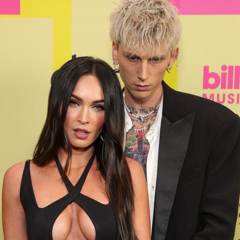 Machine Gun Kelly and Megan Fox pose backstage for