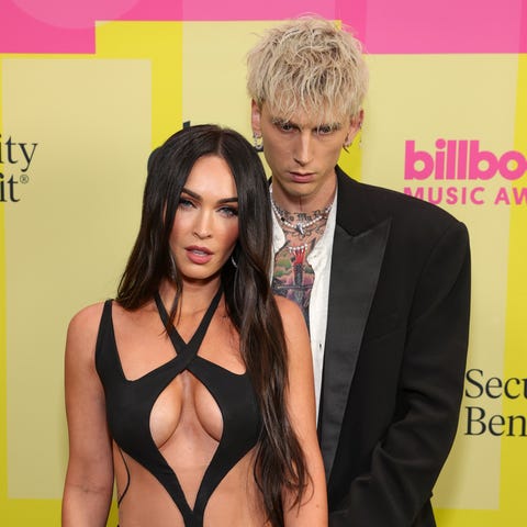 Machine Gun Kelly and Megan Fox pose backstage for