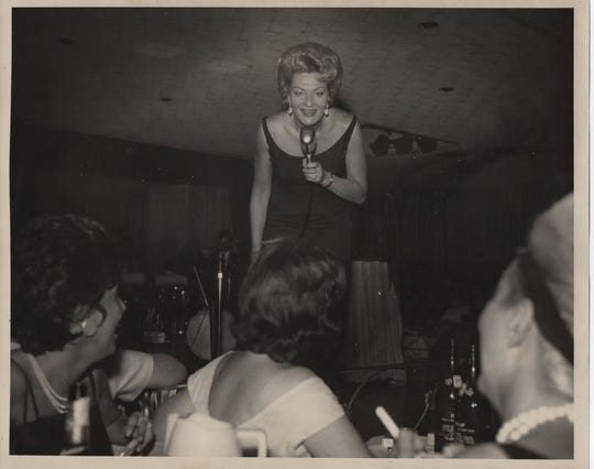 Comedian Rusty Warren, a pioneer comedian with a string of gold-selling albums in the 1960s, appears on stage at the Club Alamo in Detroit in this undated photo