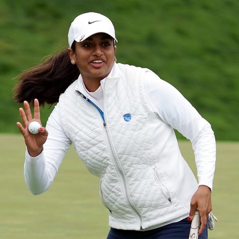 Megha Ganne waves after putting out on the eighth 