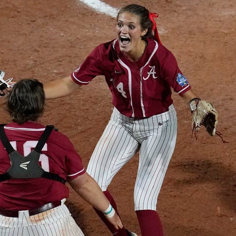 Alabama pitcher Montana Fouts, right, celebrates h