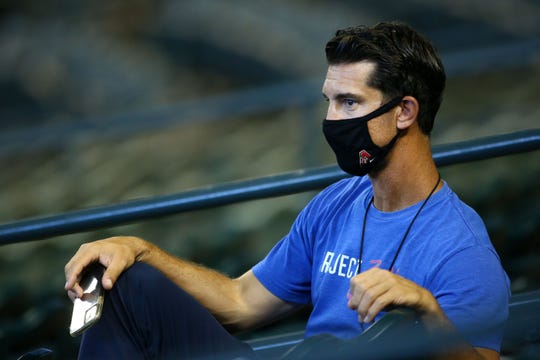 Jul 4, 2020; Phoenix, AZ, USA; Arizona Diamondbacks GM Mike Hazen watches from the stands during summer camp workouts at Chase Field.  Mandatory Credit: Rob Schumacher/The Arizona Republic via USA TODAY NETWORK