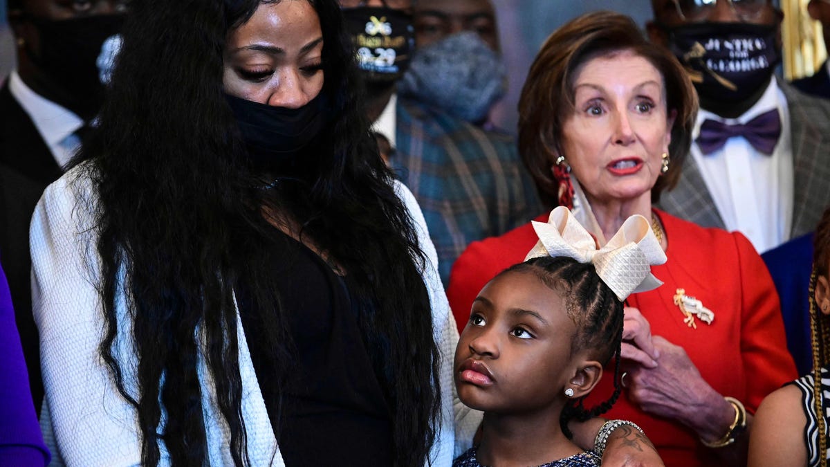 George Floyd's daughter, Gianna Floyd, her mother, Roxie Washington, and House Speaker Nancy Pelosi in Congress on May 25, 2021, the first anniversary of his murder by police.