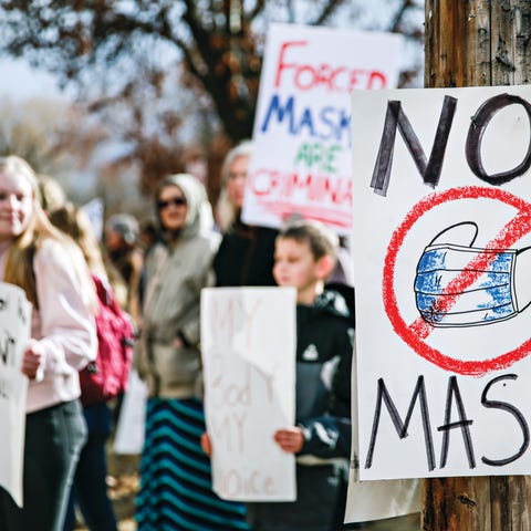 Demonstrators protest mask requirements on March 9