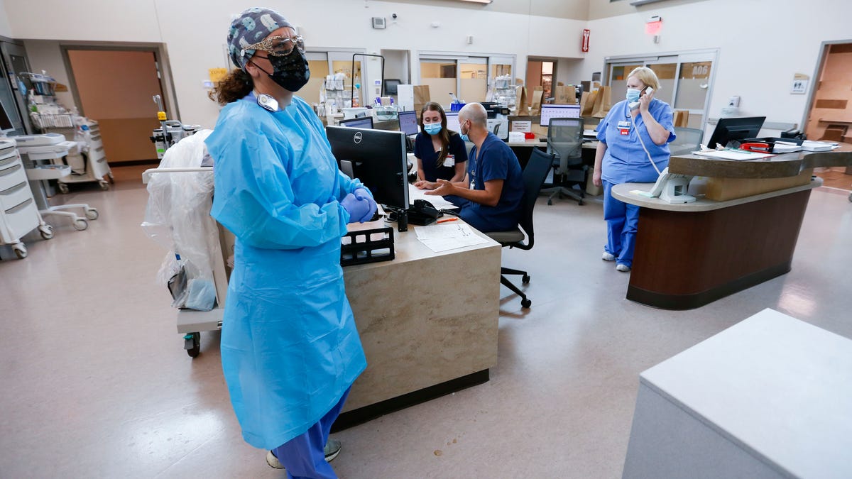 Nurses and doctors in the CoxHealth Emergency Department in Springfield, Mo. must don personal protective equipment to treat patients with COVID-19 on Friday, July 16, 2021. Southwest Missouri is seeing a surge in Delta variant cases, with hospitals nearing capacity and requesting help from the state for staffing and an alternative care site.