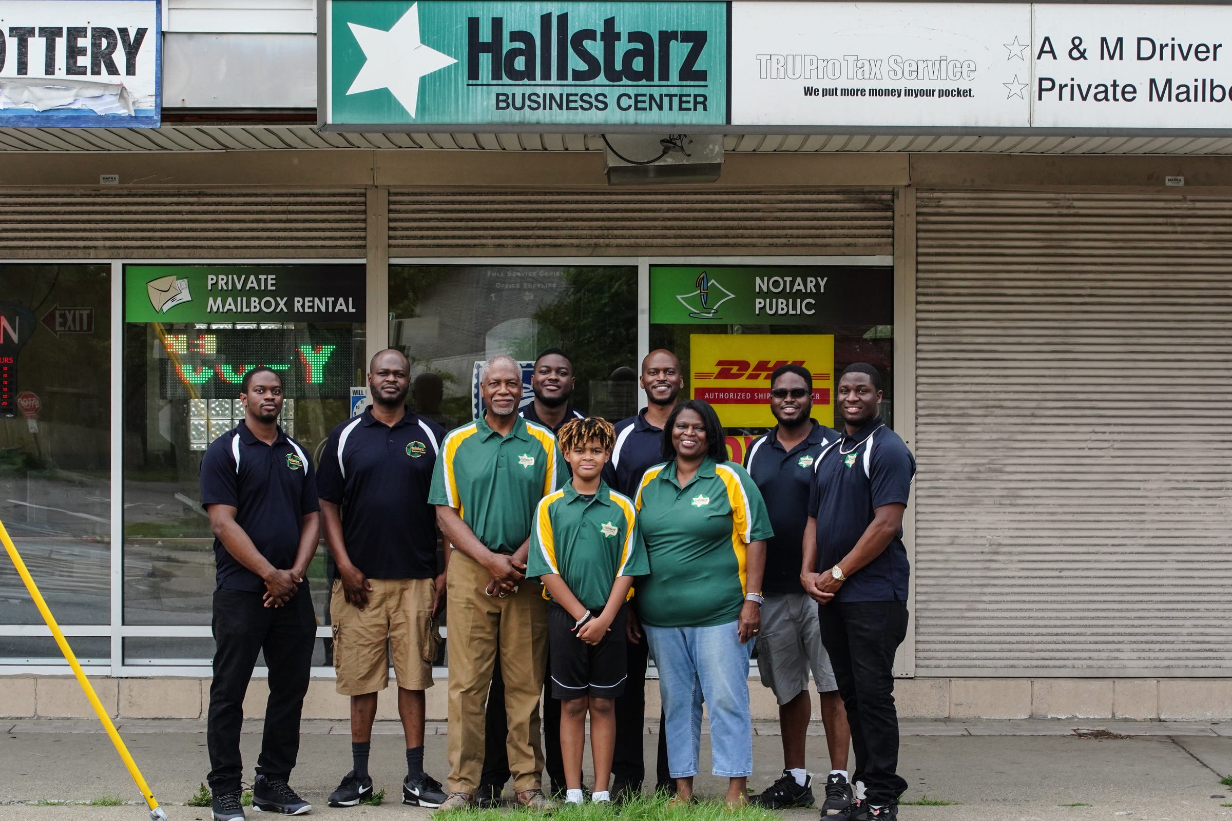 (Front to Back, L to R) Marquis Jr., 10, Milton Jr., 65, Vanessa, 66, Mylan, 32, Marquis, 44, Martez, 31, Mario, 45, Milton lll, 38, and Malik Hall, 26, in front of Hallstarz Business Center in Detroit on Thursday, July 15, 2021. The business center is a one-stop-shop in the Bagley neighborhood. A neighborhood source for packing, shipping, printing and other business services. Created 36 years ago by a Detroit couple, Milton Hall Jr. and Vanessa Hall. The business is now run by their oldest son, Mario Hall with help from his five brothers.