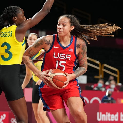 Brittney Griner (15) drives to the basket while be