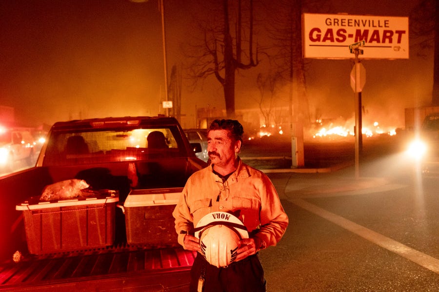 Battalion Chief Sergio Mora watches as the Dixie Fire tears through the Greenville community of Plumas County, Calif., on Wednesday, Aug. 4, 2021.