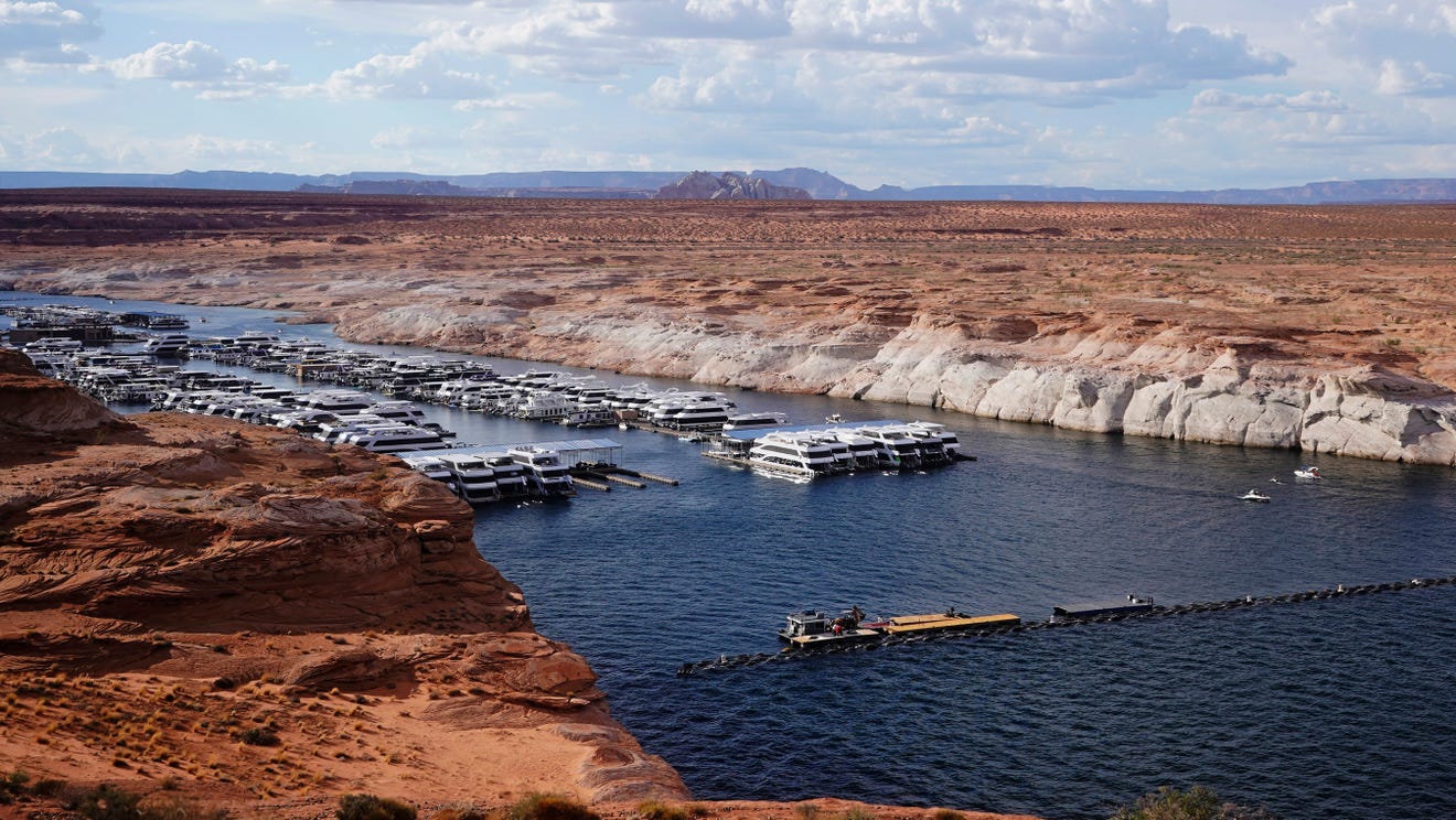 Lake Powell water levels hit record lows, forcing off some houseboats