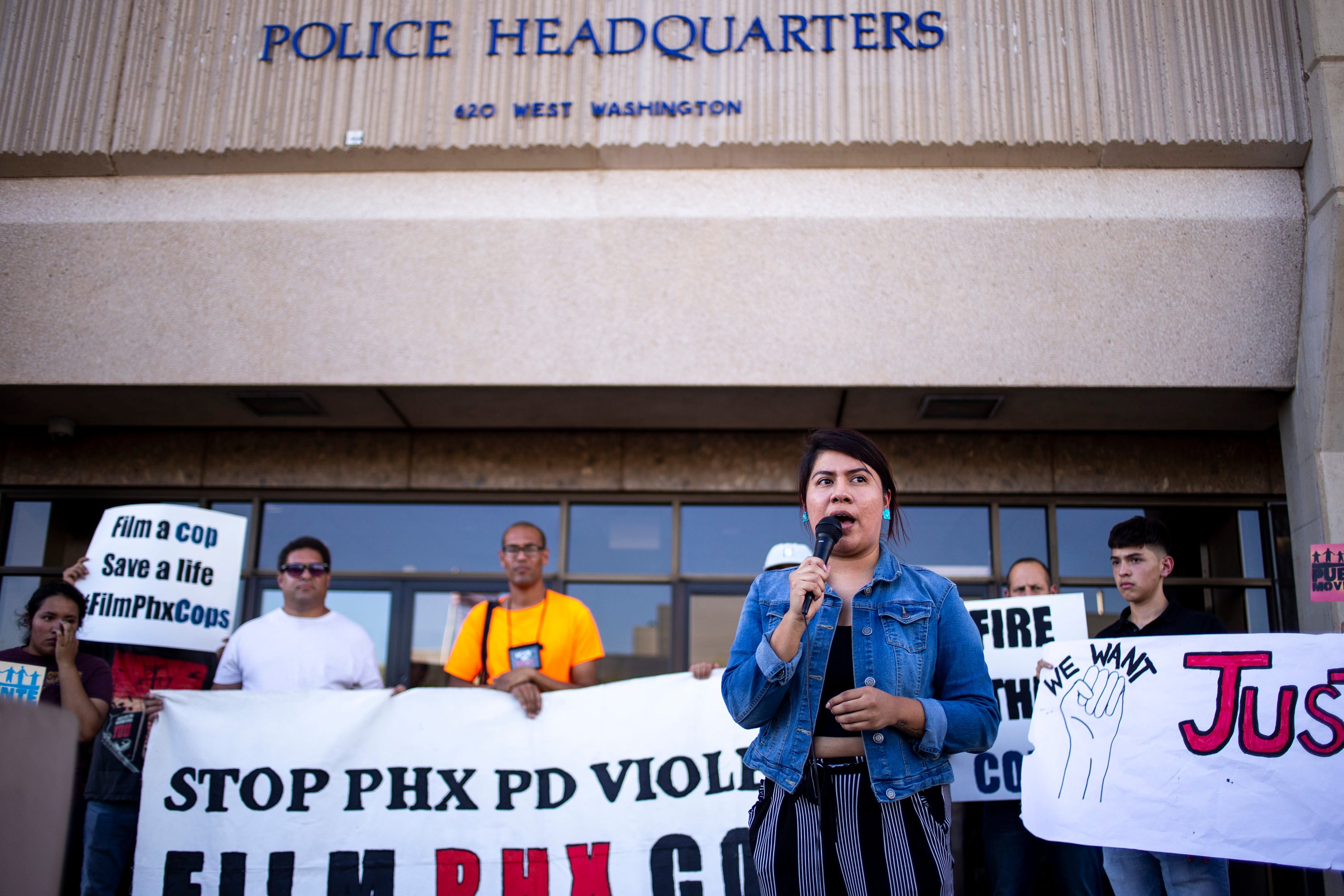 Viri Hernandez of Poder in Action speaks during a protest on June 21, 2019, outside Phoenix police headquarters.