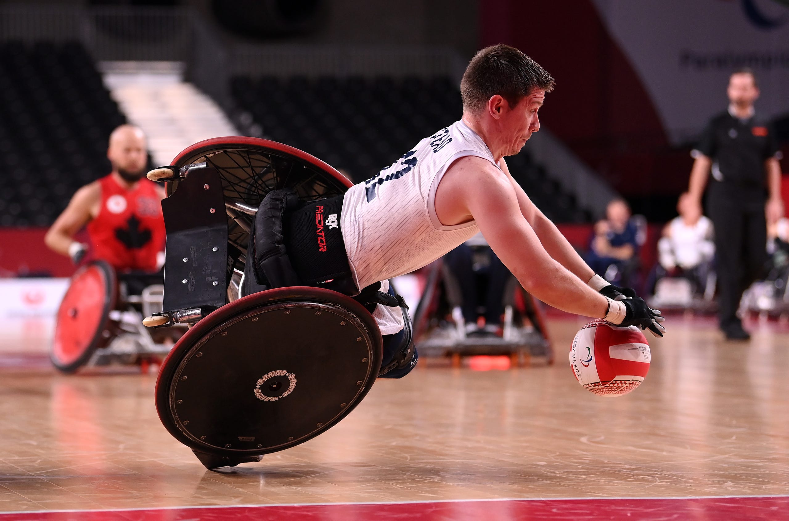 August 25, 2021: Jamie Stead of Team Great Britain falls to the floor after being tackled by Cody Caldwell of Team Canada during the Wheelchair Rugby Pool Phase Group match between Team Great Britain and Team Canada on day 1 of the Tokyo 2020 Paralympic Games at Yoyogi National Stadium  in Tokyo, Japan.