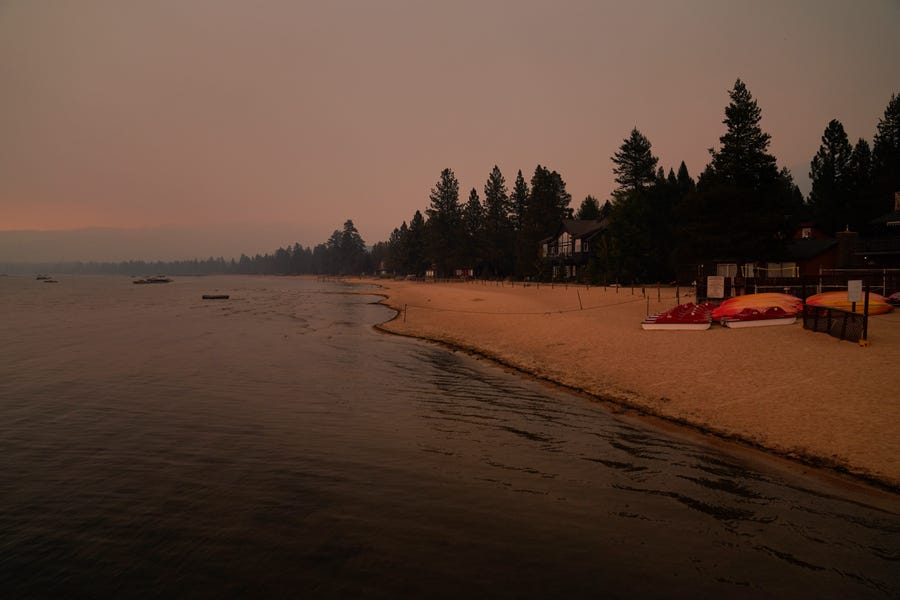 An empty beach is seen after a mandatory evacuation was ordered due to the Caldor Fire in South Lake Tahoe, Calif., Tuesday, Aug. 31, 2021. A huge firefighting force gathered Tuesday to defend Lake Tahoe from the wildfire that forced the evacuation of California communities on the south end of the alpine resort and put others across the state line in Nevada on notice to be ready to flee.