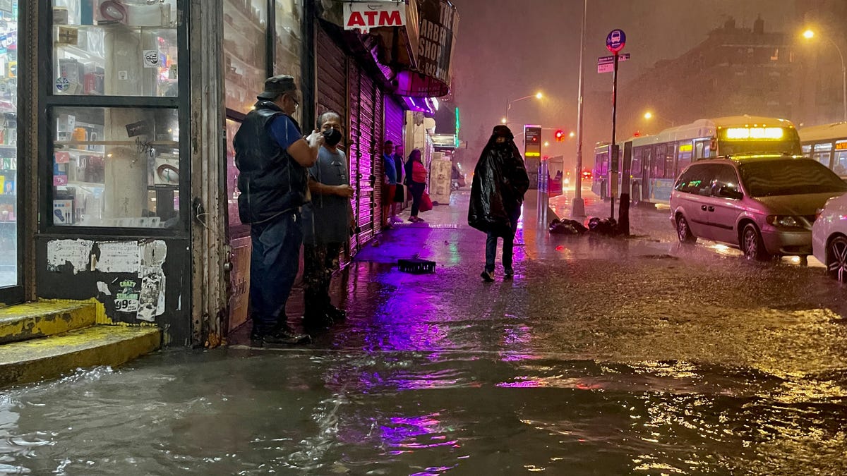 People make their way in rainfall from the remnants of Hurricane Ida in the Bronx borough of New York City. The once category 4 hurricane passed through New York City, dumping 3.15 inches of rain in the span of an hour at Central Park.