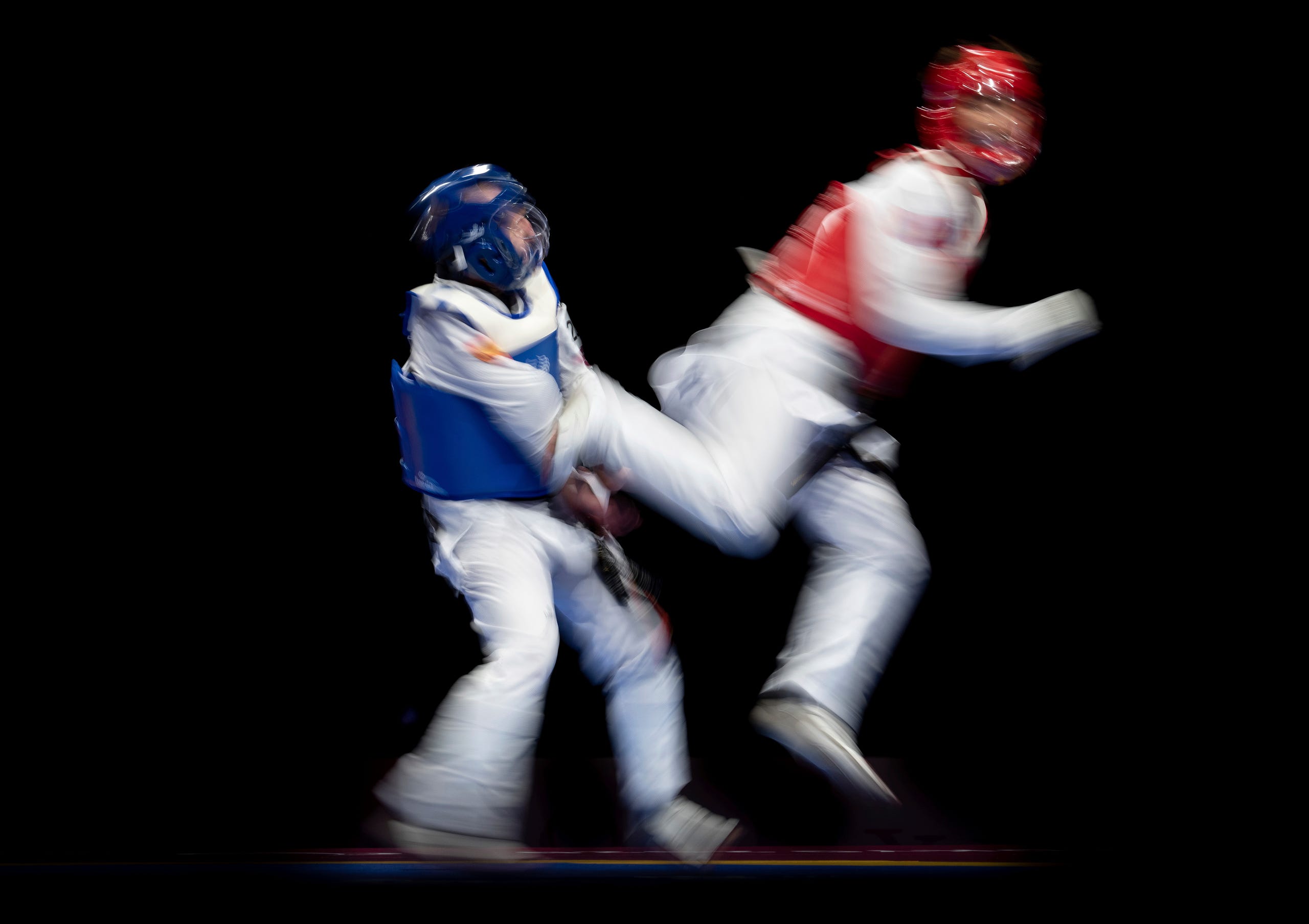 Sept. 2: Alejandro Vidal Alvarez of Spain (blue) fights against Bolor Erdene Ganbat of Mongolia (red) in the men's K44 61kg taekwondo repecharge at the Tokyo 2020 Paralympic Games in Chiba.