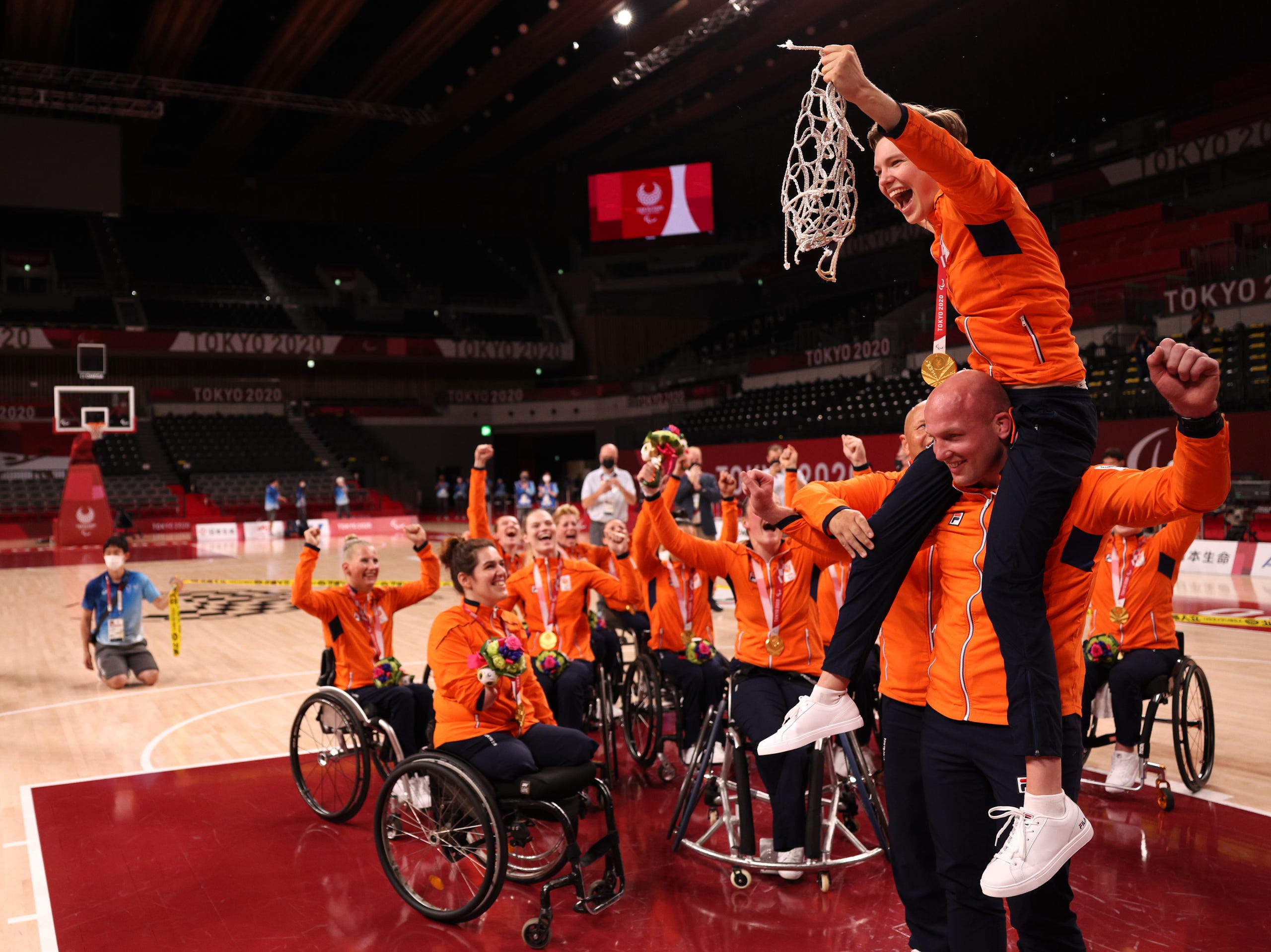 Sept. 4: Gold medalist Bo Kramer #9 of Team Netherlands cuts down the net to celebrate with her team during the women's Wheelchair Basketball medal ceremony on day 11 of the Tokyo 2020 Paralympic Games at Ariake Arena.