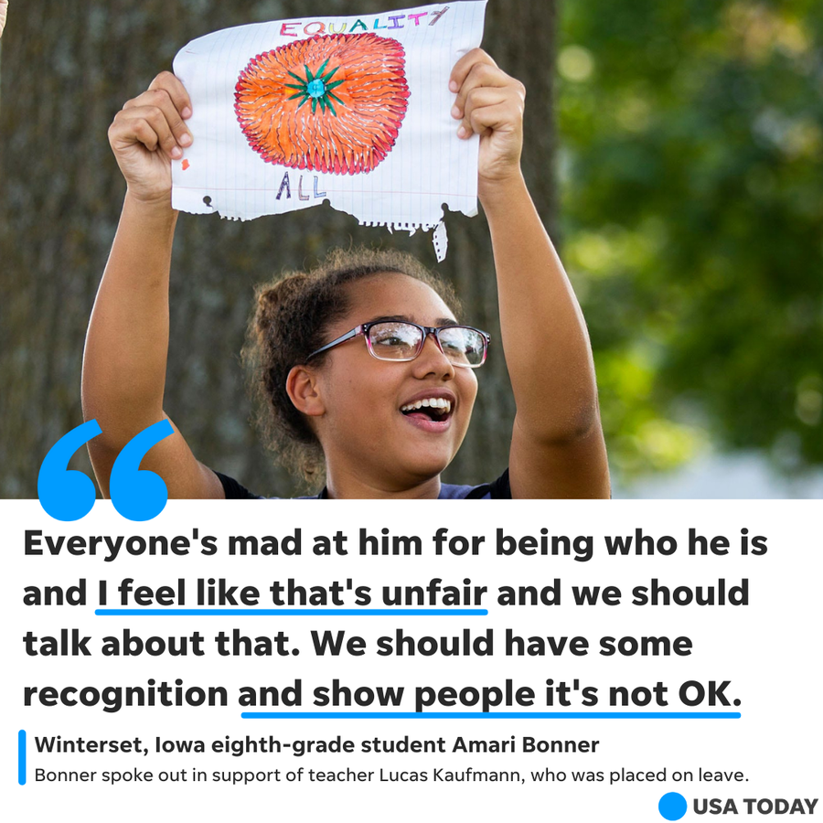 Winterset, Iowa, student Amari Bonner holds a homemade sign on Tuesday, Sept. 7, 2021 to show support for Lucas Kaufmann, a teacher who was put on administrative leave after using an image of a pride flag in a presentation to share information about himself with his students.