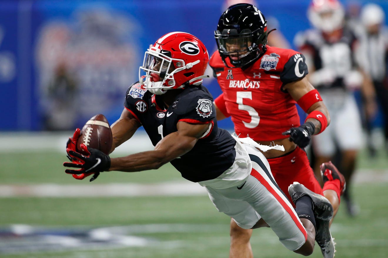 football wide receiver Pickens runs routes in practice