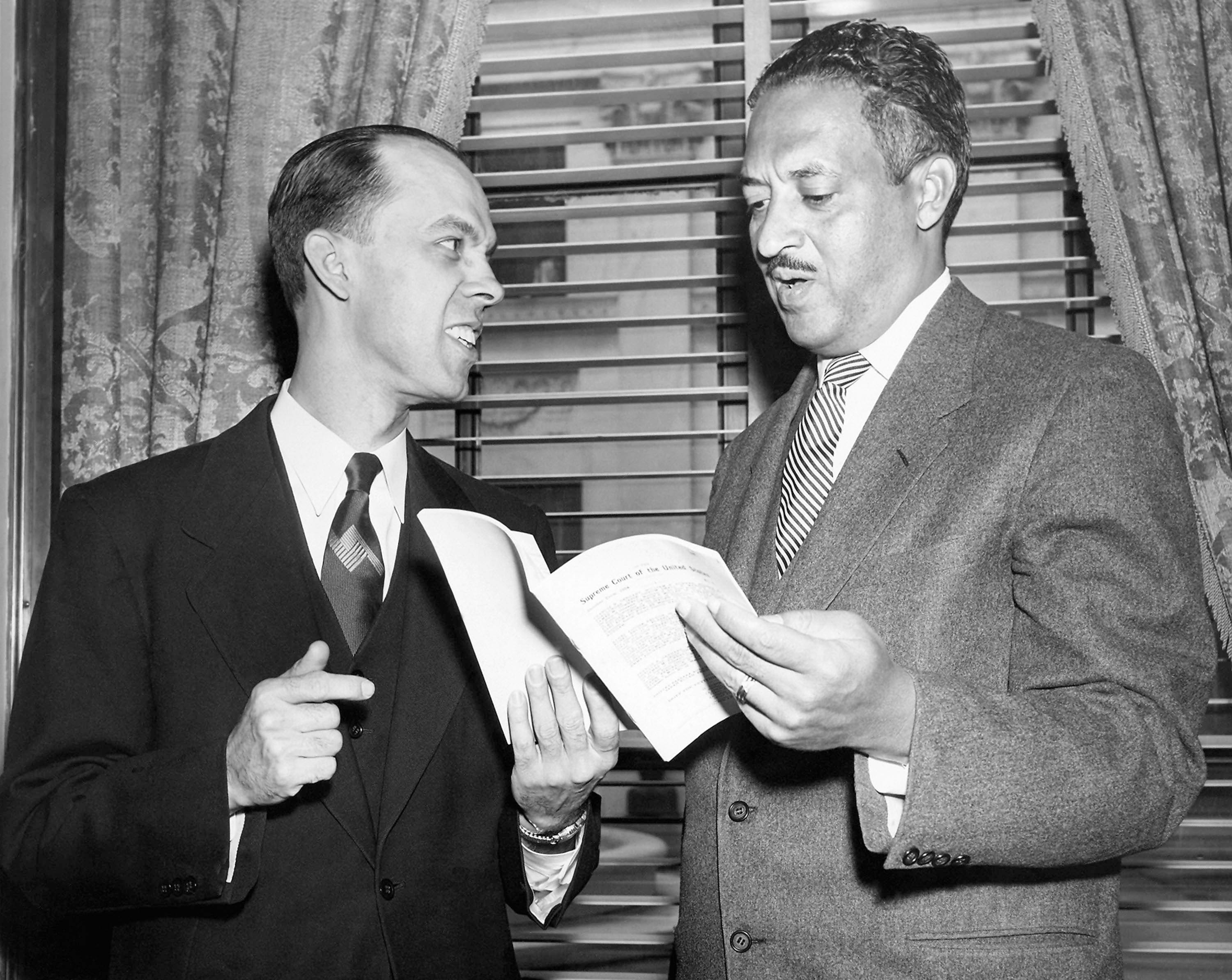 Thurgood Marshall, chief attorney for Black parents in segregation litigation, and Spottswood W. Robinson of Richmond, Va. Both confer April 12, 1955, in Washington, D.C., shortly before Marshall asked the Supreme Court to decree that separate schools for Black and white children must end.