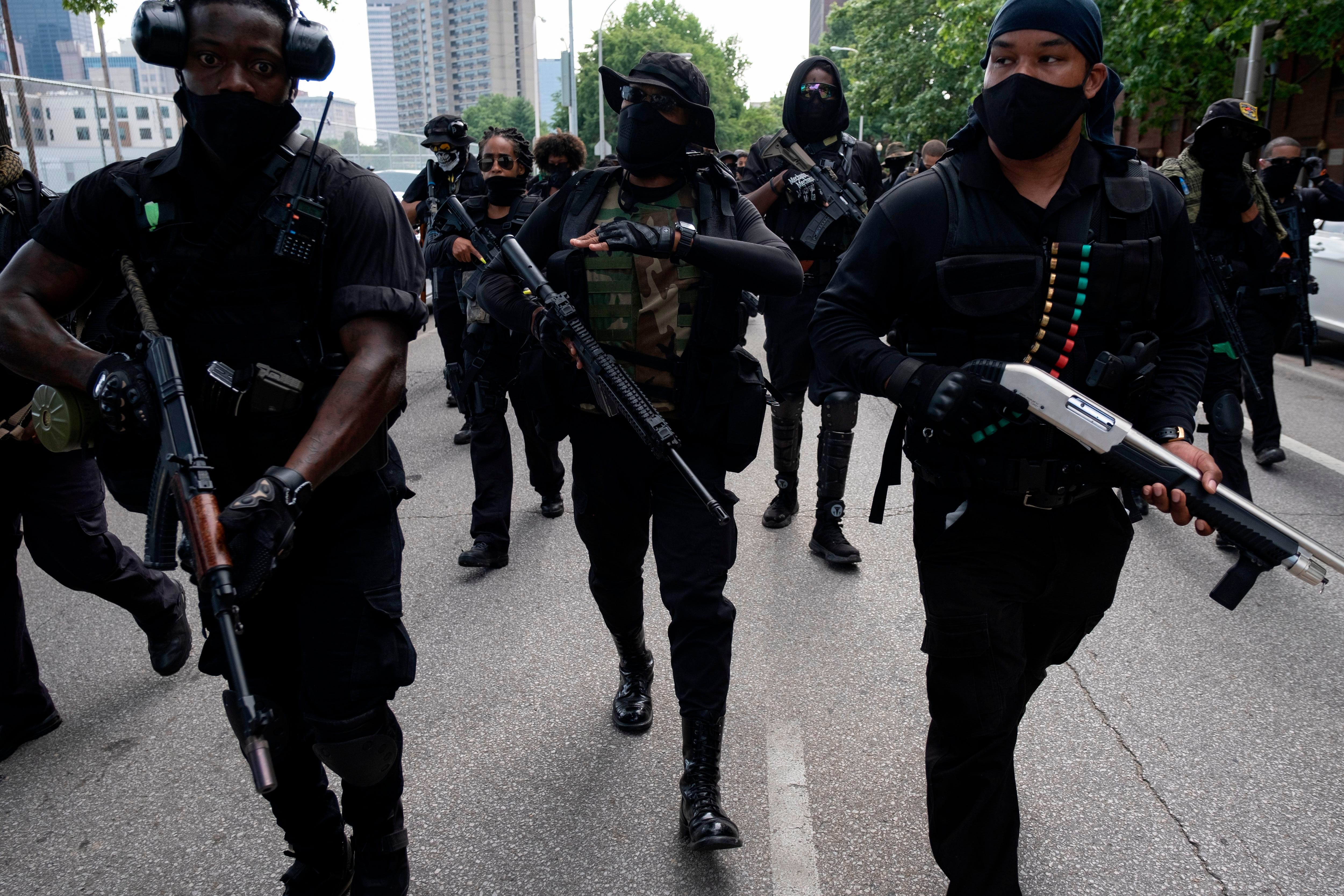 EDITORS NOTE: Graphic content / John "Grandmaster Jay" Johnson (C) marches with members of the "Not Fucking Around Coalition" (NFAC), an all-Black militia, during a rally to protest the killing of Breonna Taylor, in Louisville, Kentucky on July 25, 2020. (Photo by Jeff Dean / AFP) (Photo by JEFF DEAN/AFP via Getty Images)