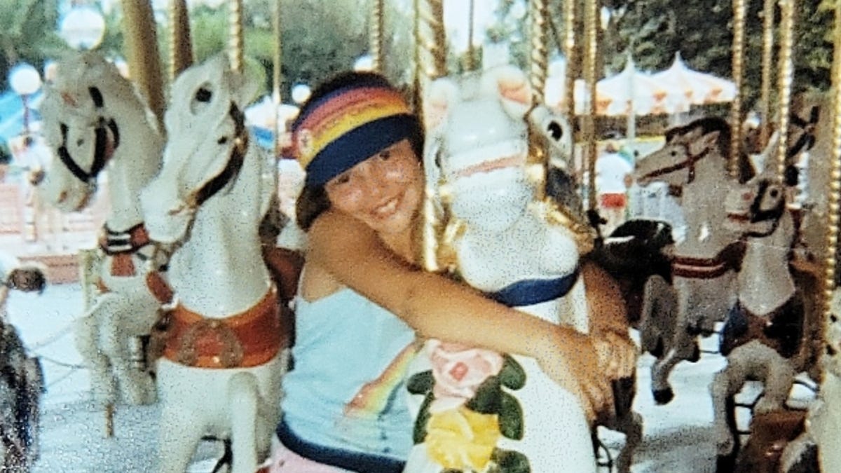 Melanie Green Merrill has been riding the same carousel horse for years at Magic Kingdom, which she affectionately named Cindy.