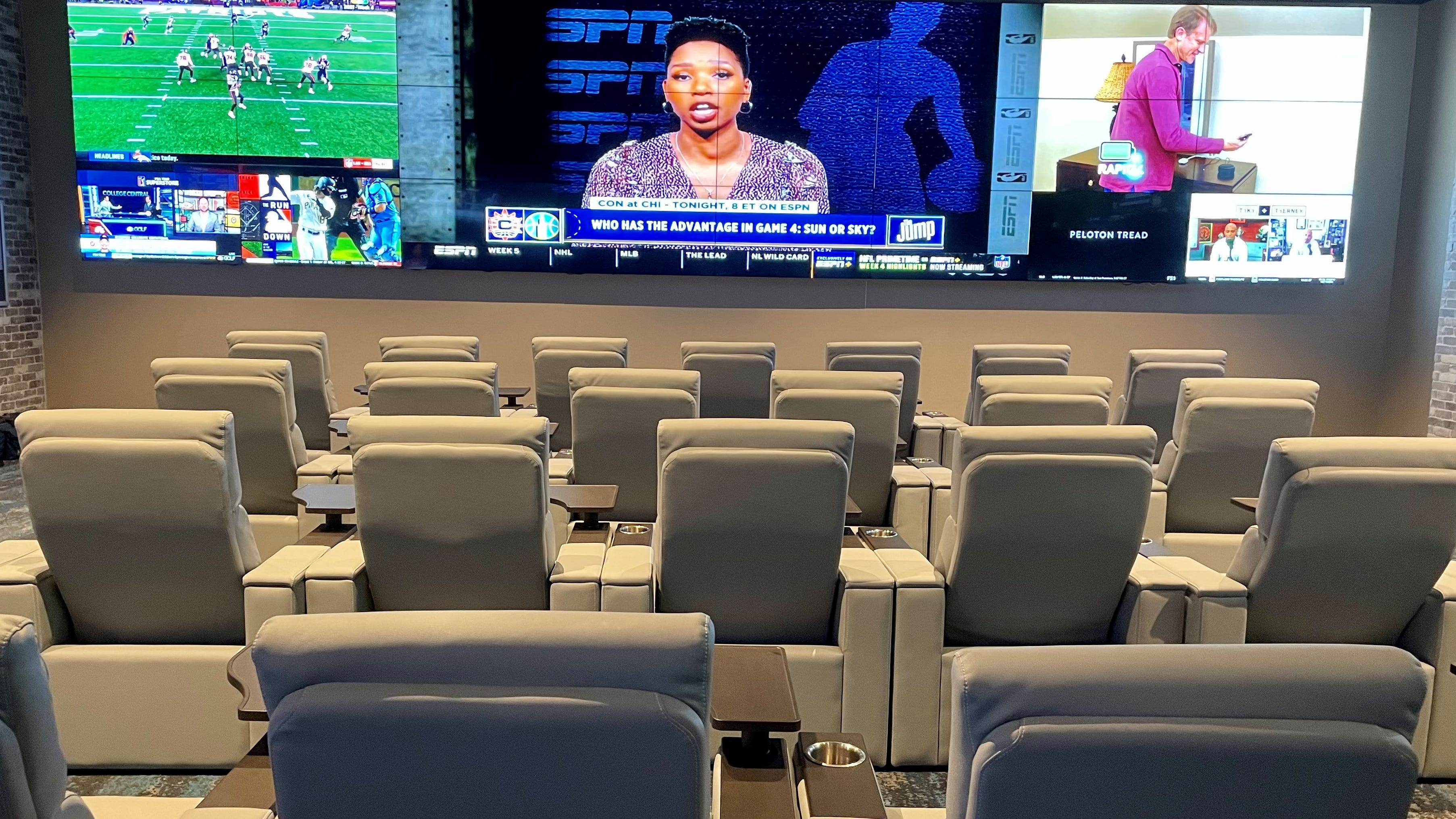 Paragon Casino Resort's new sports book, or betting parlot, features plush theater-style seating with wall-to-wall video screens.