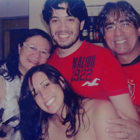 Gabriel De Hora poses with his father, mother and 