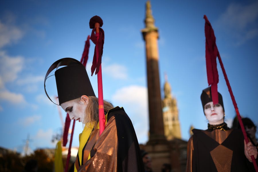 Pilgrimage groups who have walked to Glasgow are joined by members of Extinction Rebellion as they walk to raise awareness of the climate crisis on Oct. 30, 2021 in Glasgow, Scotland.