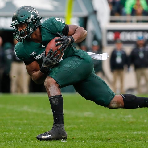 Michigan State running back Kenneth Walker III mak