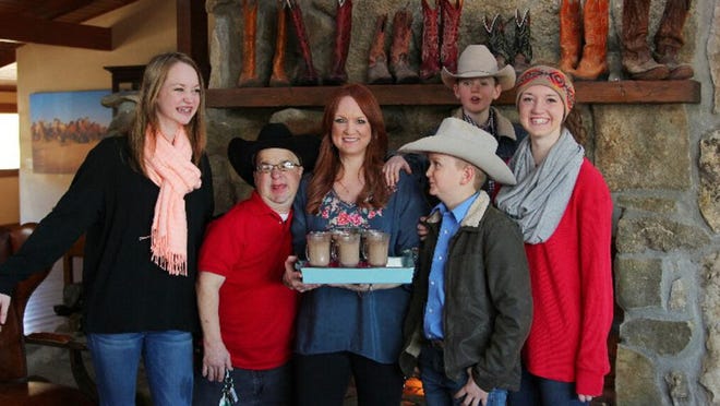Ree Drummond, center, with her brother Mike Smith and her kids. Smith, well known in Bartlesville, died Saturday.