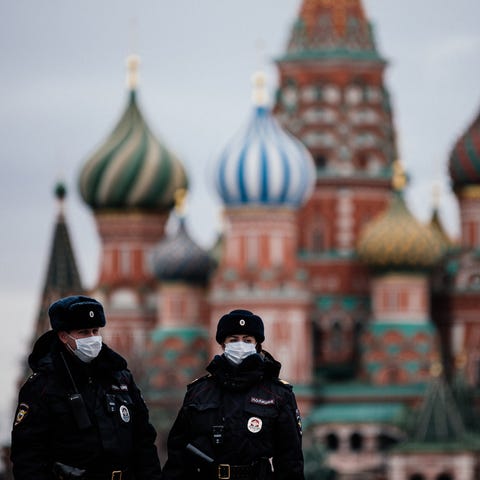 Russian police officers patrol Red Square in front