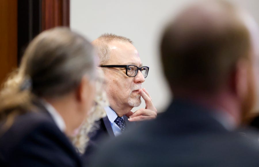 Greg McMichael, center, listens to opening statements on Friday in the trial over the killing of Ahmaud Arbery last year in Brunswick, Georgia.