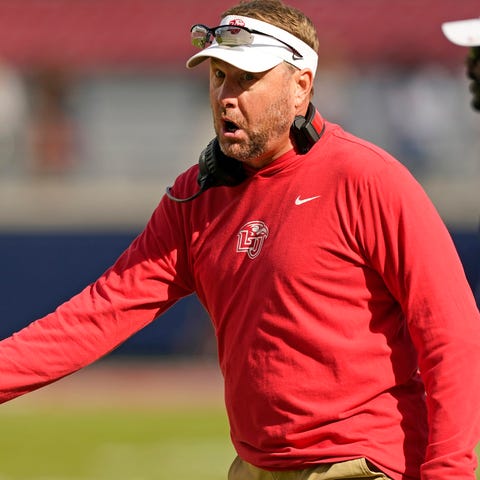 Liberty head coach Hugh Freeze has some words over