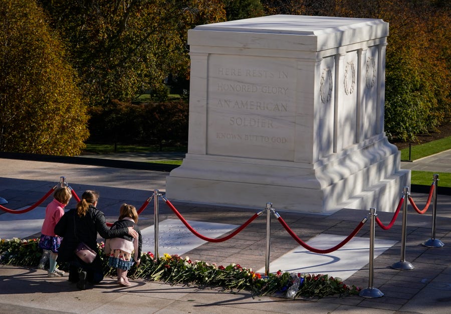 Nov. 9, 2021; Arlington, VA, USA. Members of the public lay flowers in front of the Tomb Of The Unknown Soldier at Arlington National Cemetery in Arlington, VA, on November 9, 2021. For the first time in nearly 100 years, and as part of the Tomb of the Unknown Soldier Centennial Commemoration, the public will be able to walk on the Tomb of the Unknown Soldier Plaza and lay flowers in front of the Unknown Soldier on Nov. 9 and 10, 2021. Photo by Jack Gruber, USA TODAY.