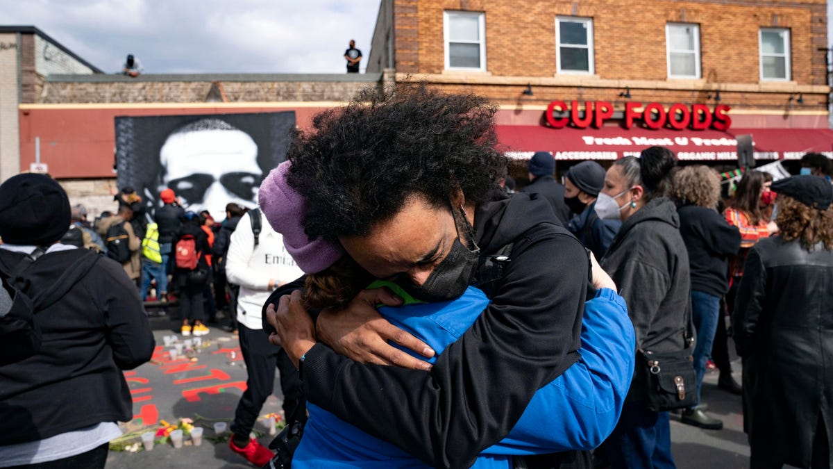 April 20, 2021: Nic Hernandez and Emma Ruddock hug in celebration after hearing the verdict of Derek Chauvin at George Floyd Square in Minneapolis, Minn.