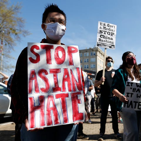 Protesters gather at City Hall during a rally and 