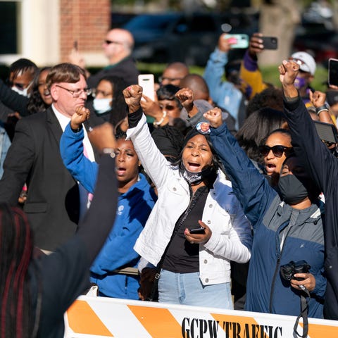 People react outside the Glynn County Courthouse f