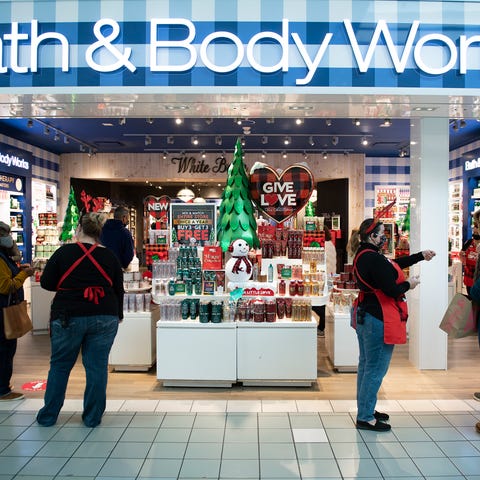 Associates with Bath & Body Works help customers o