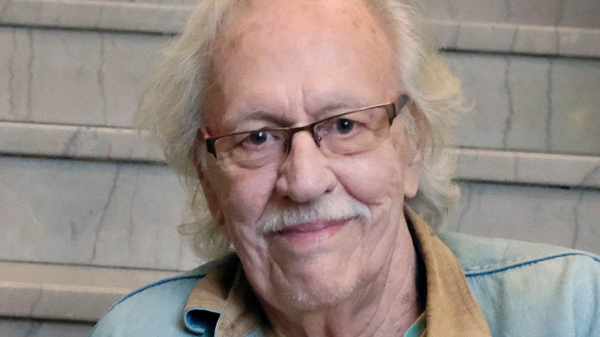 FILE - Author Ed McClanahan poses at the Carnegie Center for Literacy and Learning in Lexington, Ky., on Dec. 4, 2018. McClanahan, a Kentucky author, teacher and friend of counterculture icon Ken Kesey, died Saturday at his home in Lexington, according to his wife. He was 89. (Tom Eblen/Lexington Herald-Leader via AP, File)