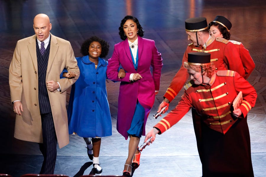 Daddy Warbucks (Harry Connick, Jr., left), Annie (Celina Smith) and Grace (Nicole Scherzinger) go out for a night on the town.