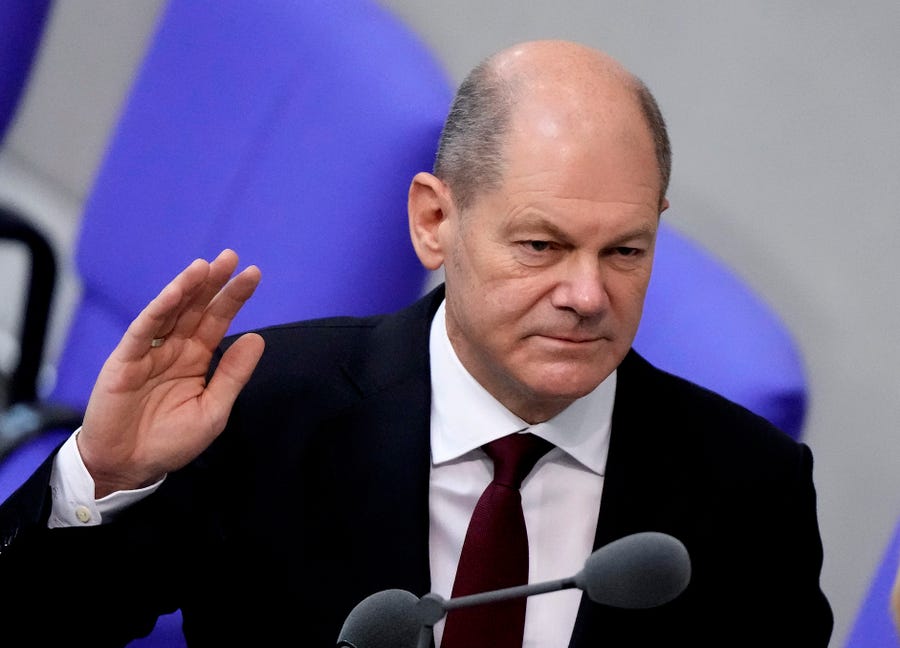 New elected German Chancellor Olaf Scholz is sworn in by parliament President Baerbel Bas in the German Parliament Bundestag in Berlin, Wednesday, Dec. 8, 2021.