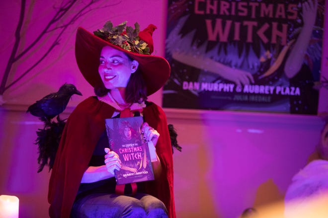 Aubrey Plaza and Dan Murphy read some of their new children's book "Legend of a Christmas Witch" at the Brandywine Hundred Library Wednesday, Dec. 15, 2021. 