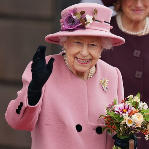 Queen Elizabeth II waves as she leaves after atten