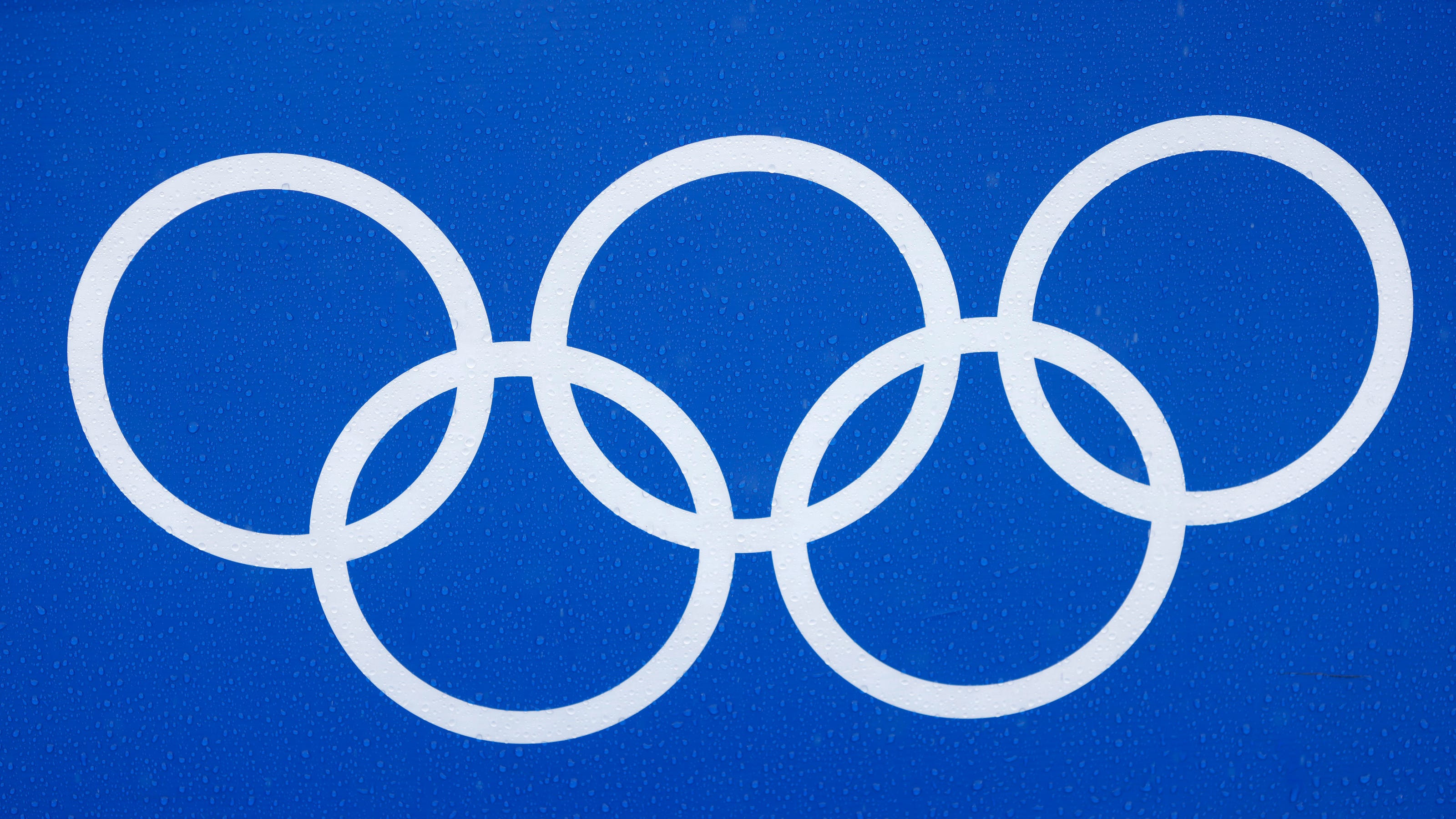 Мок в медицине. Логотип Олимпийских игр 2026. Олимпийские кольца 80 годов. Спонсоры Олимпийских игр. МОК.