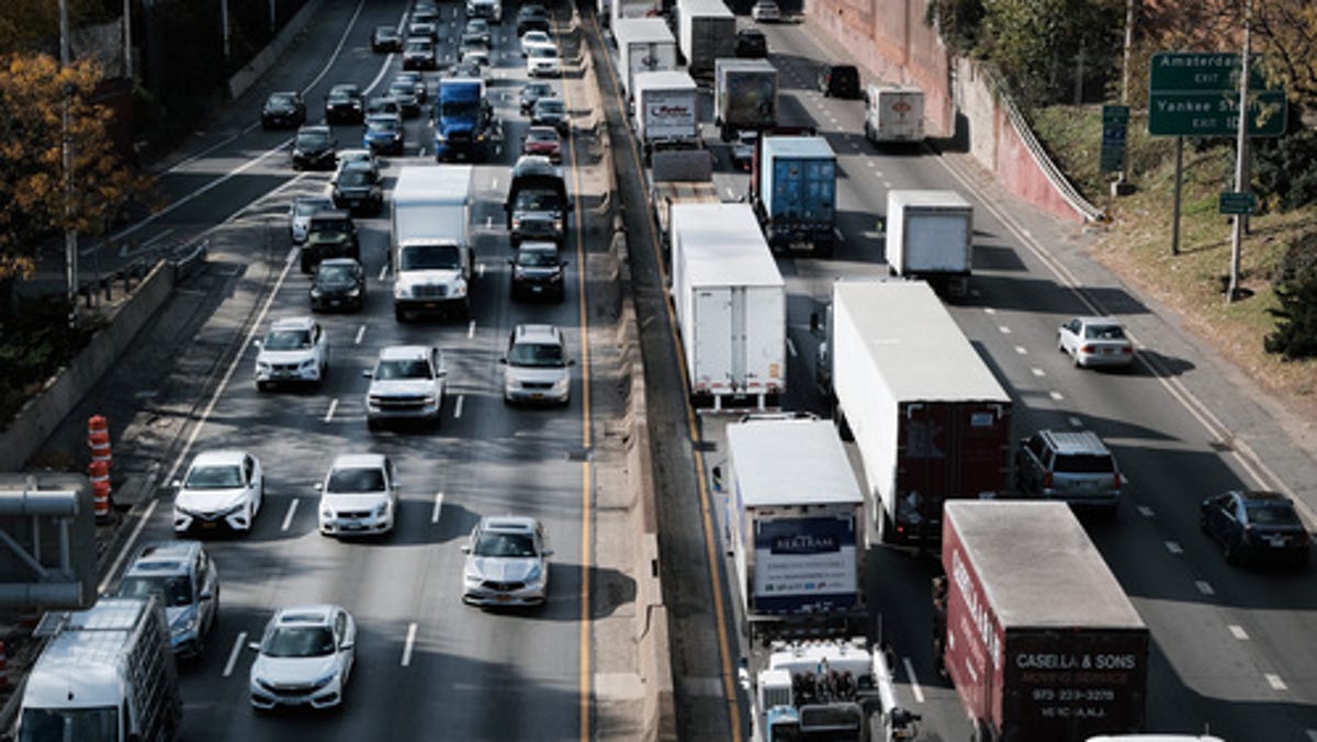 Cars and trucks move along the Cross Bronx Expressway, a notorious stretch of highway in New York City that is often choked with traffic and contributes to pollution and poor air quality on November 16, 2021 in New York City.