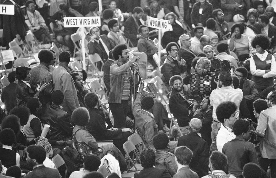 Rev. Jesse Jackson, executive director of Operation PUSH, speaks from the floor of the National Black Political Convention in Gary, Indiana in March 1972. "If we do nothing else today, we ill have made a revolutionary step toward a black political nation in this country and in the world," he said. î (AP Photo/Jim Wells) ORG XMIT: APHS353022 [Via MerlinFTP Drop]