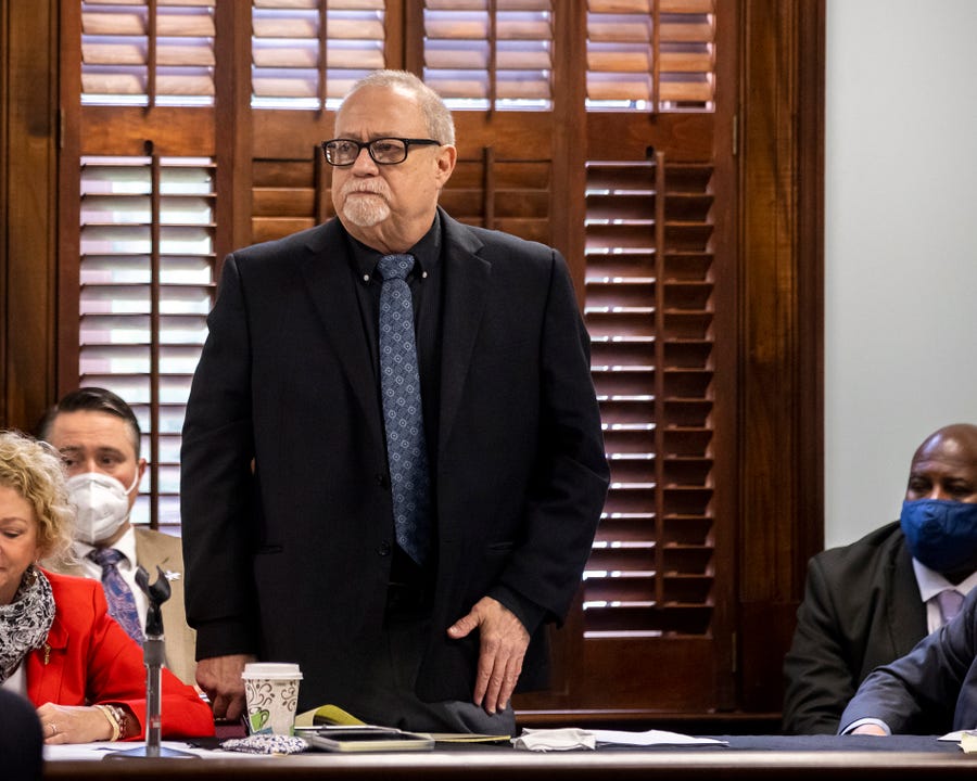 Greg McMichael stands to be recognized during jury selection at the Glynn County Courthouse in Brunswick, Ga.